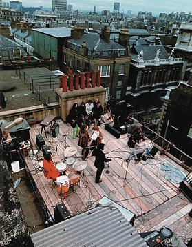 The Beatles performing on the roof of  3 Savile Row on 30th January 1969.