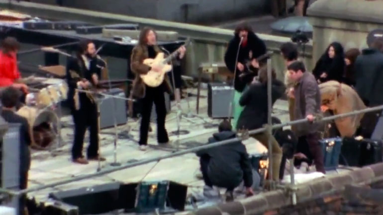 The Beatles performing on the roof of 3 Savile Row.